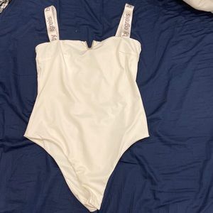 By Egreis white bodysuit size medium